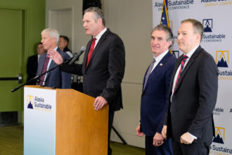 Gov. Mike Dunleavy speaks at a press conference during the Alaska Sustainable Energy Conference in Anchorage. Dunleavy is joined by (from left) Energy Secretary Chris Wright, Interior Secretary Doug Burgum and EPA Administrator Lee Zeldin. Credit: Kate Furby/Inside Climate News