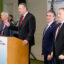 Gov. Mike Dunleavy speaks at a press conference during the Alaska Sustainable Energy Conference in Anchorage. Dunleavy is joined by (from left) Energy Secretary Chris Wright, Interior Secretary Doug Burgum and EPA Administrator Lee Zeldin. Credit: Kate Furby/Inside Climate News