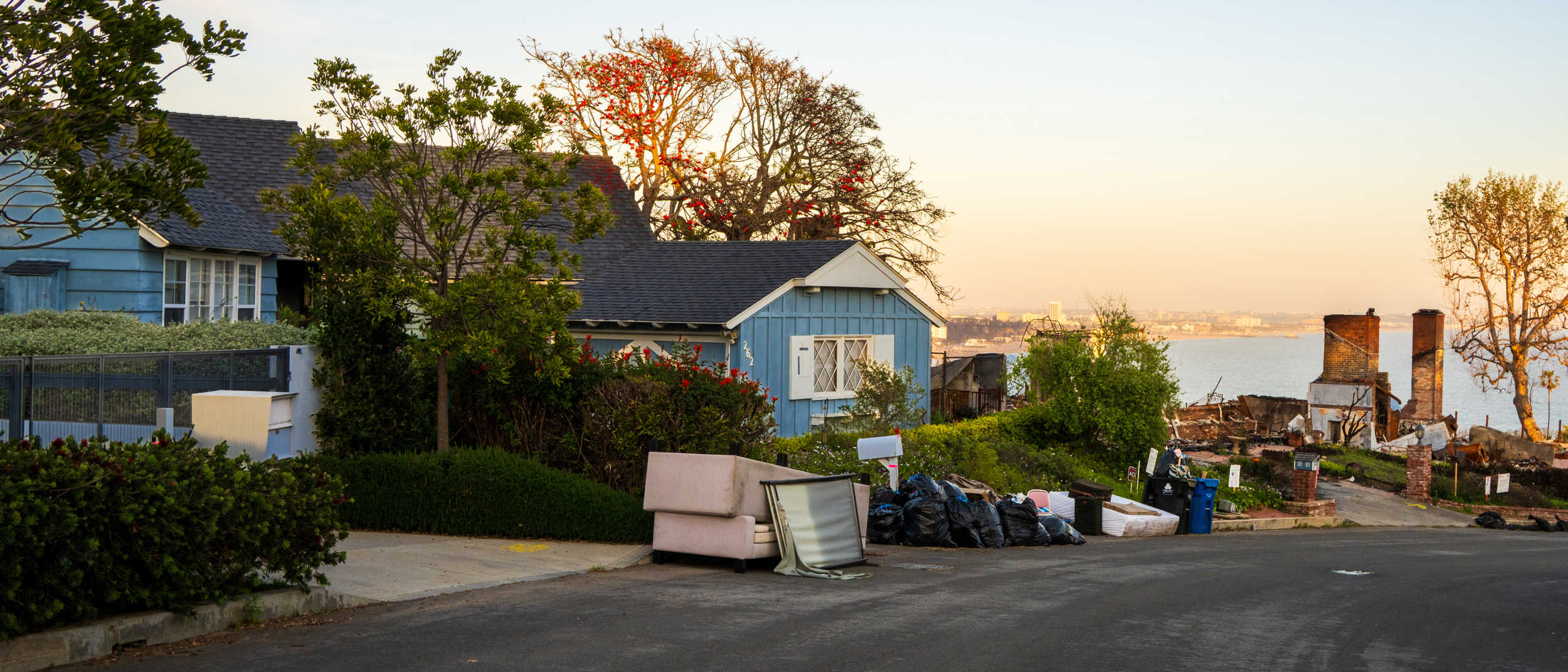 The Armm family’s contaminated belongings sit piled in front of 262 Quadro Vecchio Drive. Brendan has followed city protocol, and put in a call every week for bulk waste disposal from the city, but three weeks after he made his first call, none of the items have been picked up.