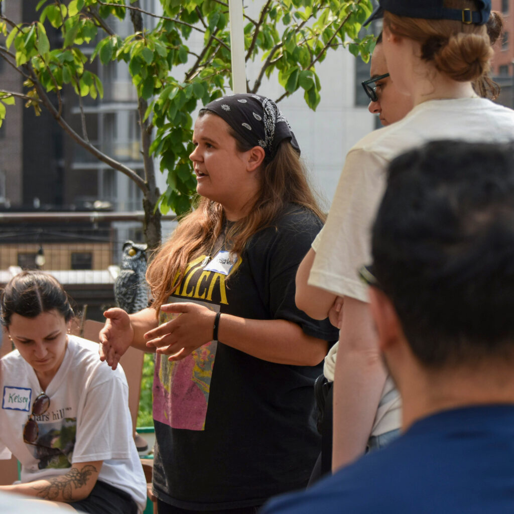 Chrisaleen Ciro explains the day’s tasks to United Talent Agency volunteers. Credit: Ryan Krugman/Inside Climate News