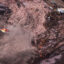 A helicopter overflies the area of a collapsed dam as rescue workers search for victims near the town of Brumadinho in southeastern Brazil on Jan. 25, 2019. Credit: Douglas Magno/AFP via Getty Images