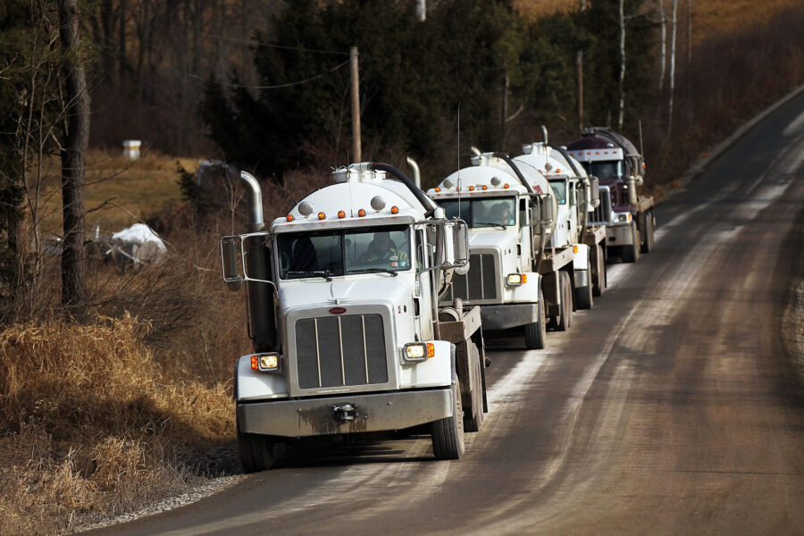 Trucks with the oil and gas industry drive through the countryside in Springville, Pa. Credit: Spencer Platt/Getty Images