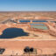 Evaporation ponds hold produced water amid the oil wells of the Permian Basin in Loco Hills, N.M. Credit: Jim West/UCG/Universal Images Group via Getty Images