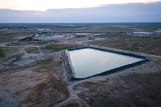 A fracking wastewater pond is seen in the Permian Basin near Odessa, Texas. Credit: Jon Shapley/Houston Chronicle via Getty Images