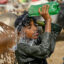 A child pours water over himself to cool off during a heat wave at a cattle market in Karachi on May 31. Credit: Rizwan Tabassum/AFP via Getty Images