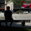 A man cools off in the shade at Daley Plaza as temperatures climbed into the mid-90s on June 23 in Chicago. Credit: Scott Olson/Getty Images