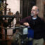 Rev. Nathan Ives of the St. Peter’s-San Pedro Episcopal Church in Salem, Mass., stands next to an aging gas-fired, steam boiler in the church basement. Credit: Jonathan Wiggs/Boston Globe