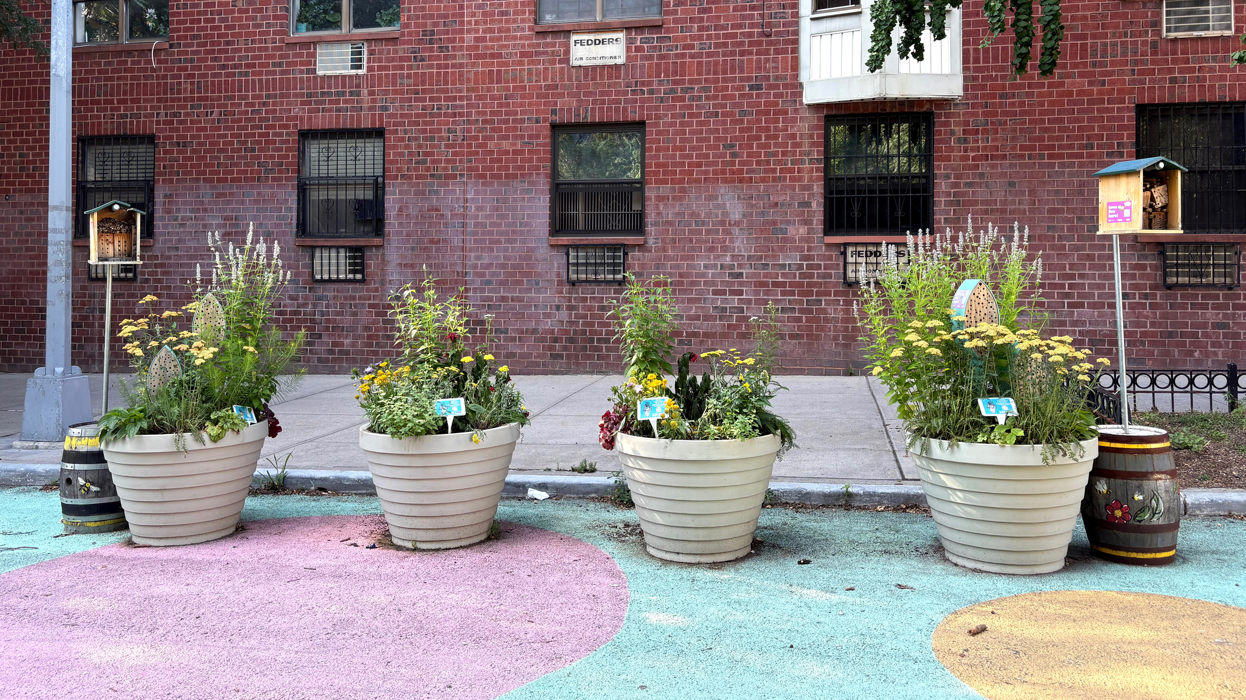 Street planters are fitted with bee hotels and bee bunkers in Brooklyn, New York City. Credit: Lauren Dalban/Inside Climate News
