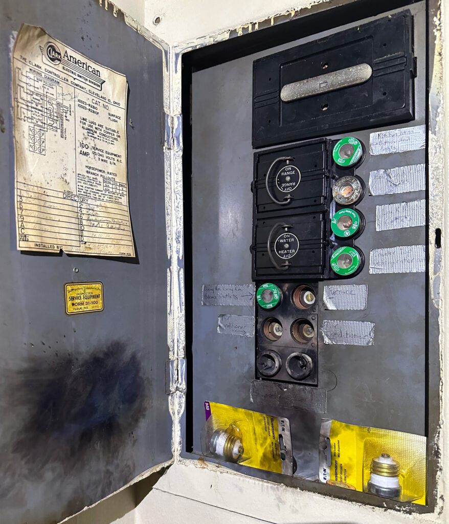 Kim Overstreet’s panel box was scorched by the power surge, and several fuses blew out of the box. Credit: Kim Overstreet