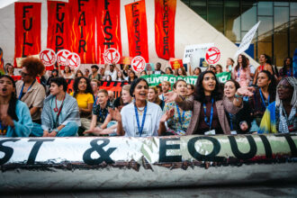 Ayshka Najib (second from right), a climate activist based in the United Arab Emirates, protests at the United Nations climate summit in Dubai, UAE, in 2023. Credit: Courtesy of Ayshka Najib