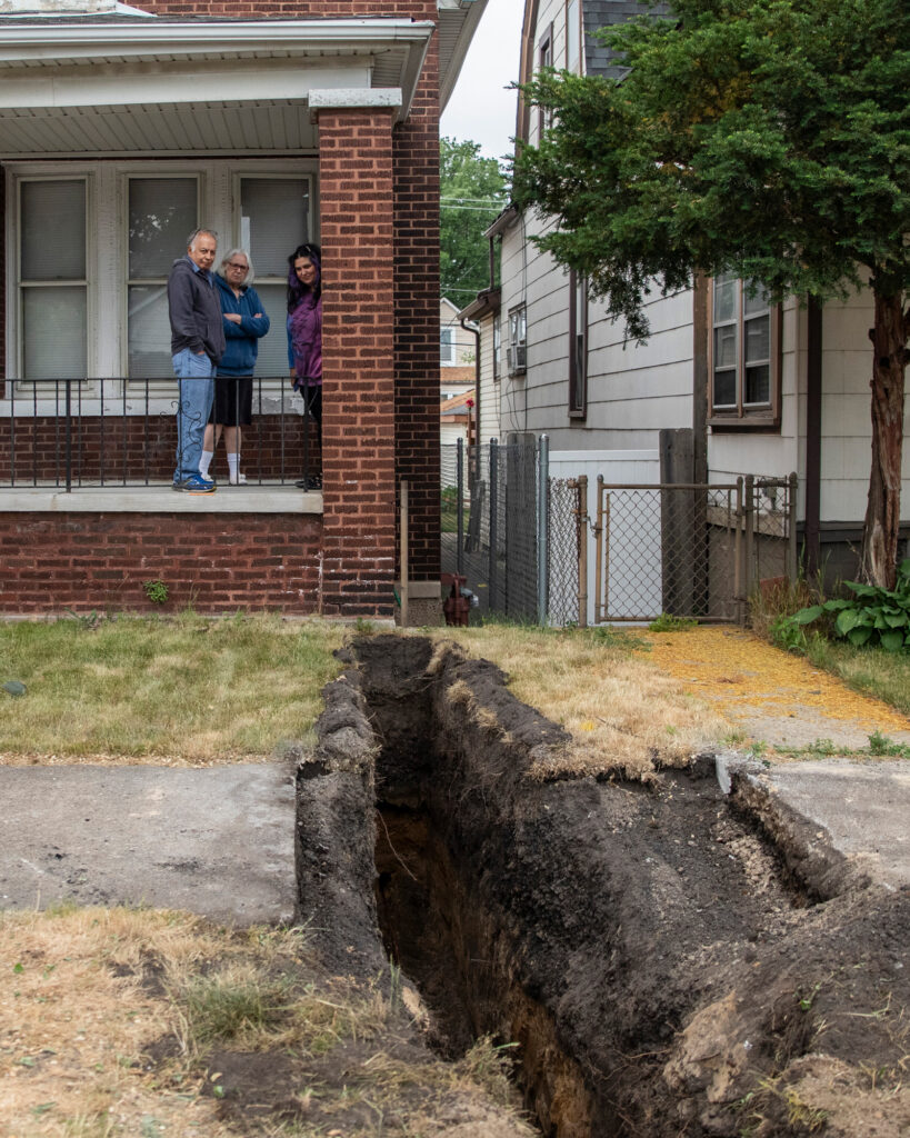A Chicago family watches as their lead service line is replaced in June 2023. Credit: Vanessa Bly/NRDC