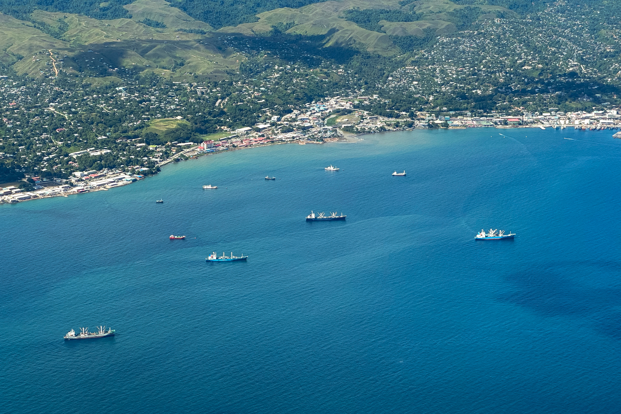 Industrial tuna fleets from countries such as China transfer their tuna catch to other ships at sea just off the coast of Honiara, the Solomon Islands’ capital city. Most of the tuna caught in Solomon Islands’ waters never enters the local market. Credit: Nathan Eagle/Civil Beat