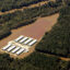An industrialized swine farm in Wayne County, N.C., is covered in flood water during Hurricane Matthew in 2016. Credit: Rick Dove
