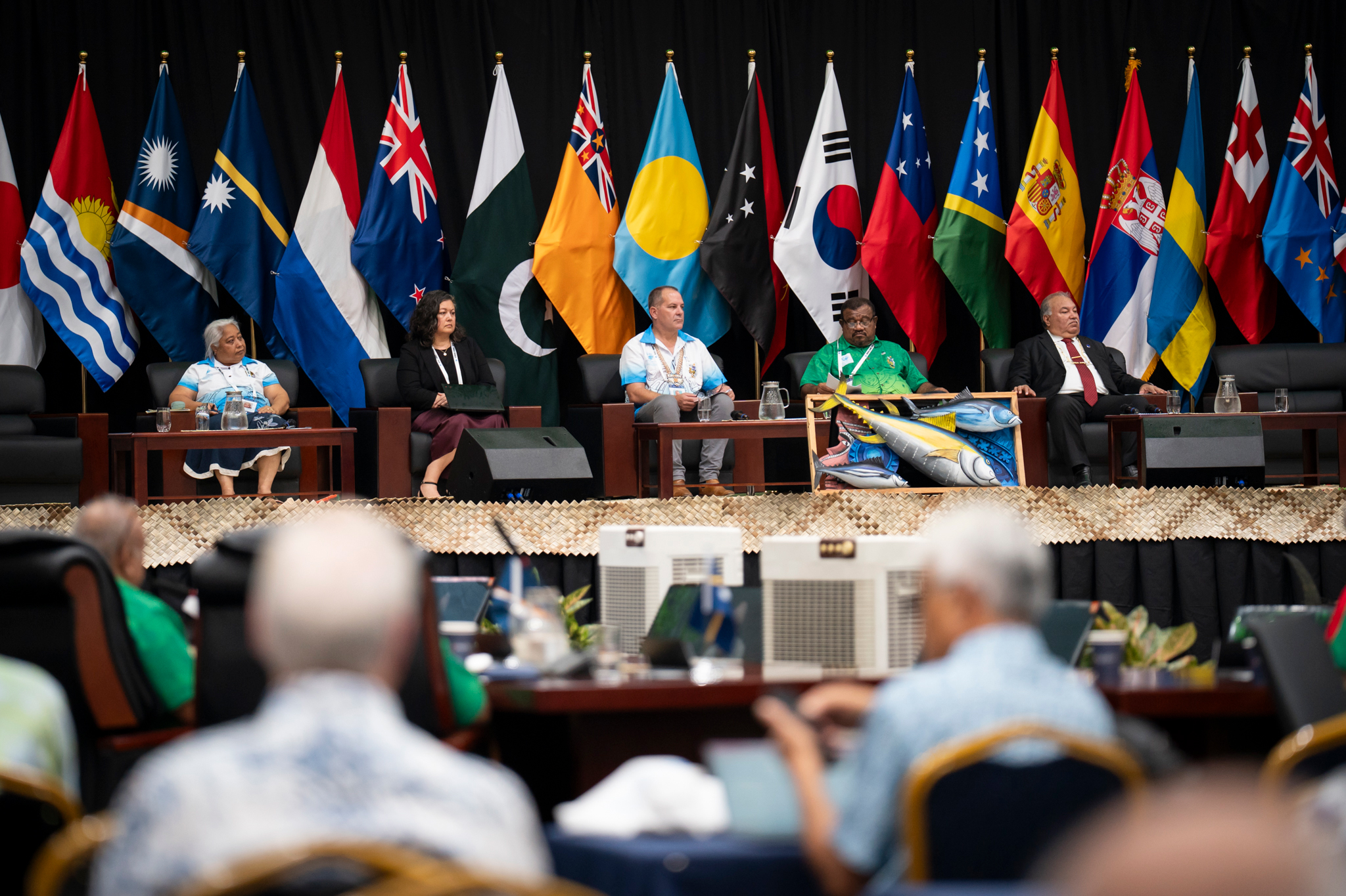 Delegates, including Western and Central Pacific Fisheries Commission Executive Director Rhea Moss-Christian, second from left, prepare for a panel discussion on fisheries management at the Honiara Summit. Credit: Nathan Eagle/Civil Beat