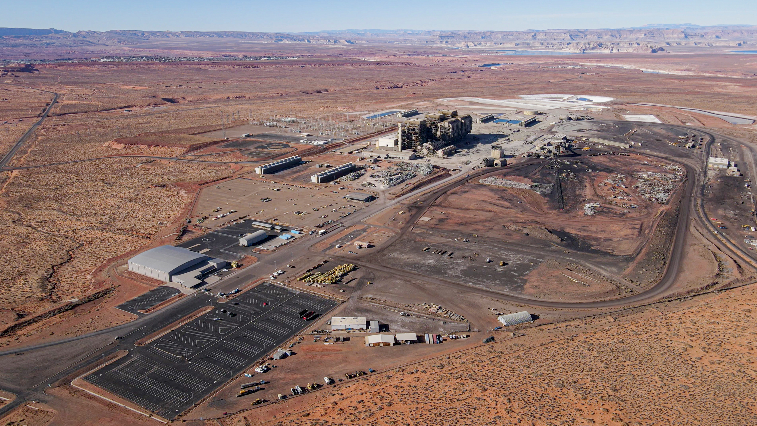 The three smokestacks of the Navajo Generating Station were demolished in December 2020. Credit: EcoFlight