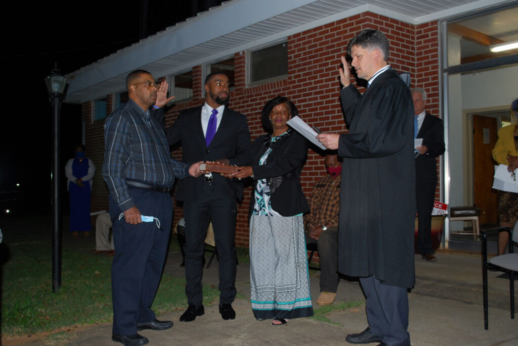 Messiah Williams-Cole was sworn in as mayor of Camp Hill, his parents next to him, when he was still a 21-year-old senior at Auburn University. Credit: Courtesy of Auburn University