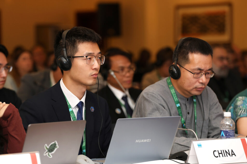 Chinese delegates listen to a COP15 session on July 23. Credit: Convention on Wetlands