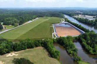 The covered coal ash pond at Alabama Power’s Plant Gadsden sits adjacent to the Coosa River in Gadsden, Ala. Credit: Courtesy of Coosa Riverkeeper