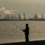People fish across from the oil refineries inside the Texas City industrial complex in Texas on May 4, 2021. Credit: Mark Mulligan/Houston Chronicle via Getty Images