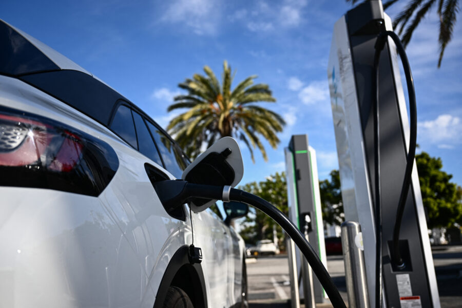 A Volkswagen ID.4 EV charges at a shopping mall parking lot in Torrance, Calif., on Feb. 23, 2024. Credit: Patrick T. Fallon/AFP via Getty Images