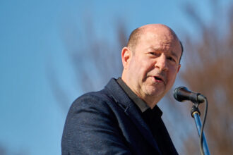 Climate scientist Michael Mann speaks to a crowd protesting the Trump administration’s federal funding cuts during the Stand-Up for Science Rally on March 7 in Washington, D.C. Credit: Dominic Gwinn/Middle East Images/AFP via Getty Images