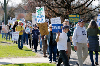 Demonstrators march during a “Hands off the EPA” rally on April 22 outside the agency’s offices in Ann Arbor, Mich. Credit: Jeff Kowalsky/AFP via Getty Images