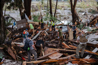 Search and rescue workers dig through debris after flash flooding on July 6 in Hunt, Texas. Credit: Jim Vondruska/Getty Images