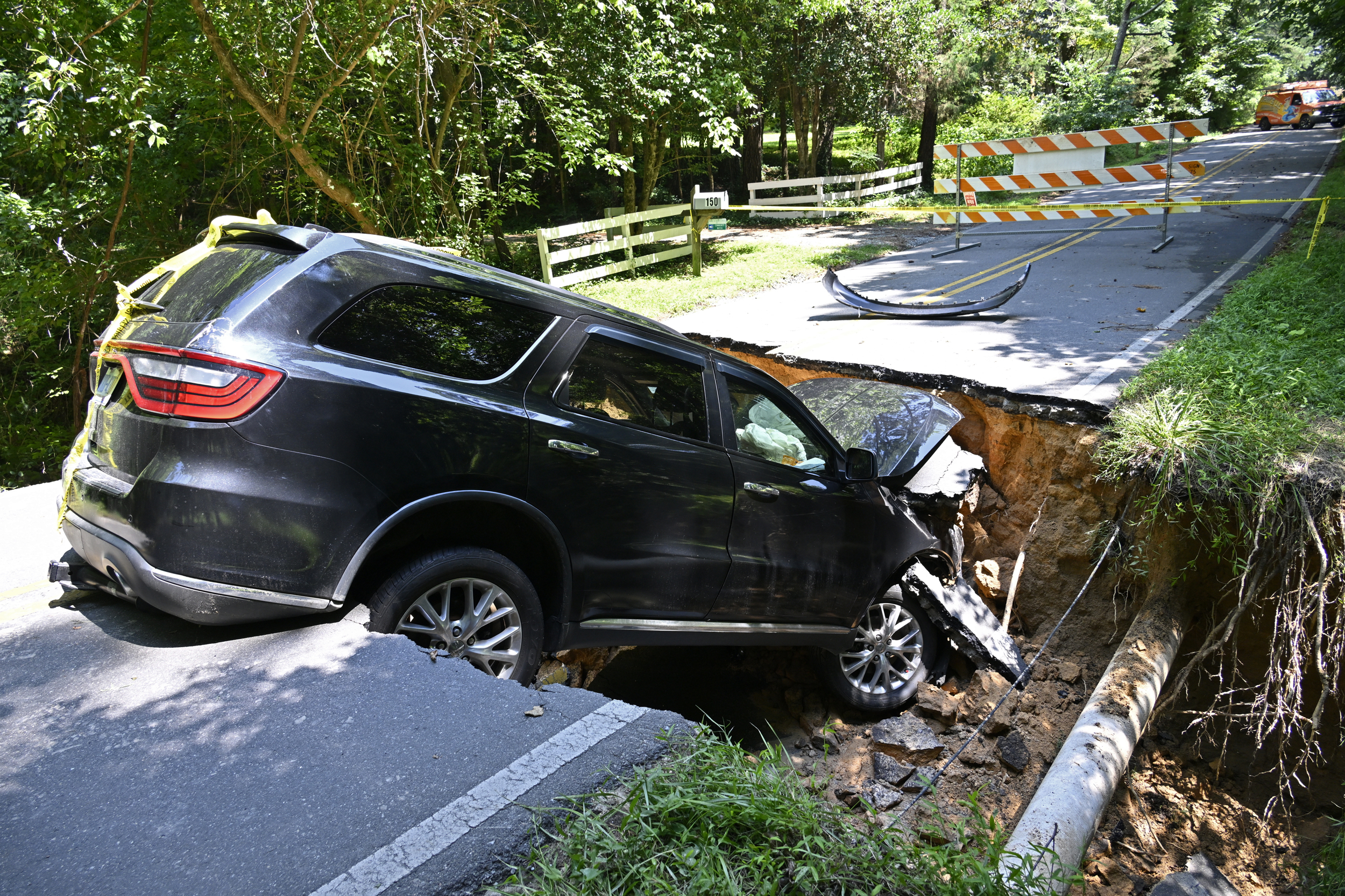 A washed away road in the aftermath of Tropical Storm Chantal on Monday in Chapel Hill, N.C. Credit: Peter Zay/Anadolu via Getty Images
