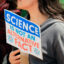 A woman holds a sign saying "Science in not an alternative fact" at the 2017 March for Science rally in Lafayette, Ind. Credit: Education Images/Universal Images Group via Getty Images