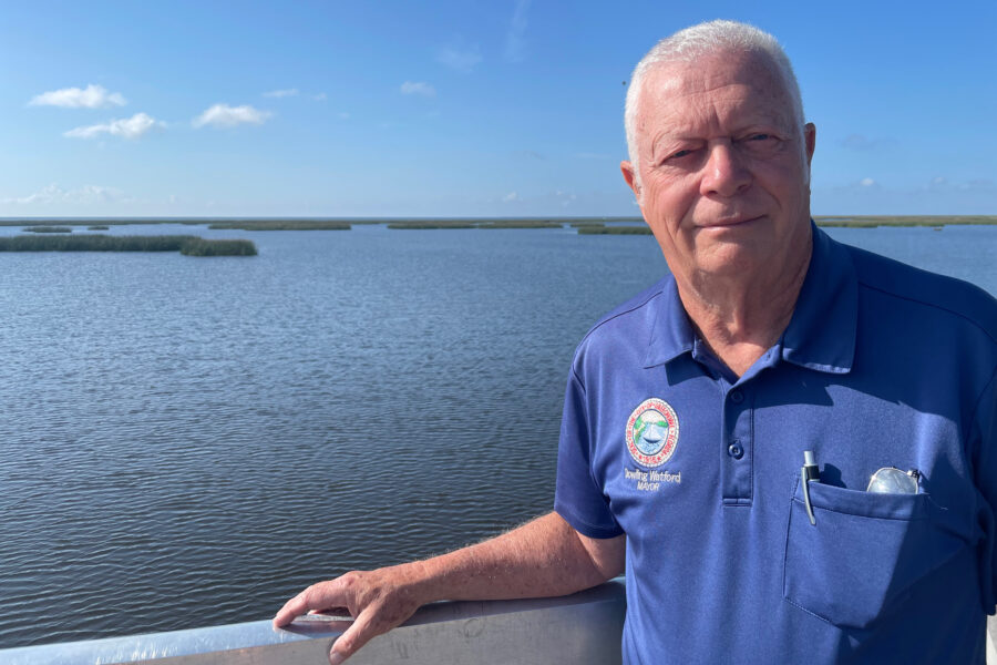 Okeechobee Mayor Dowling Watford stands in front of Florida’s Lake Okeechobee in May. Credit: Amy Green/Inside Climate News