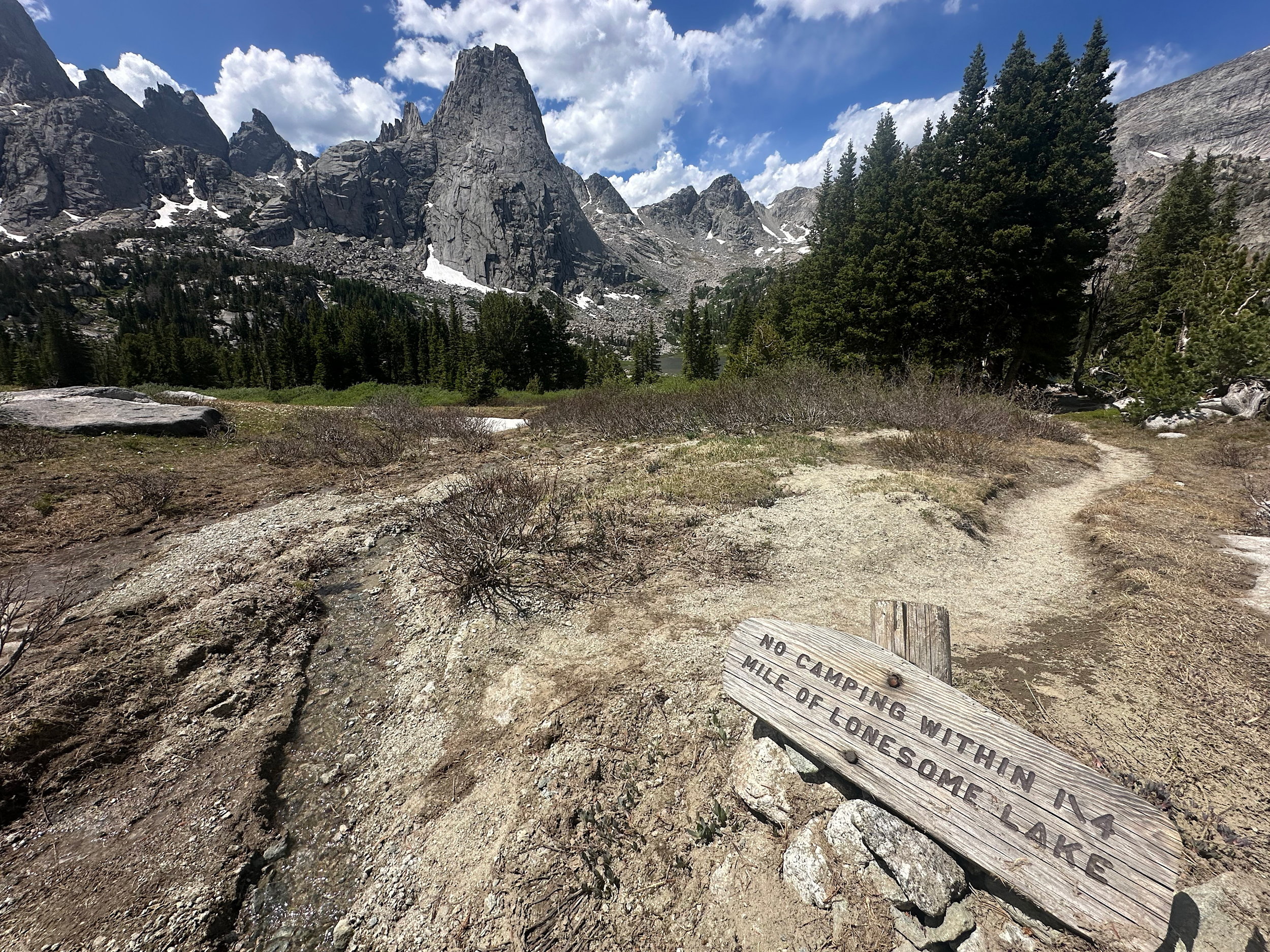 The Shoshone National Forest has imposed special regulations to protect the water and resources near Lonesome Lake, one of the most-visited interior destinations in the Wind River Range. The restrictions may not be enough to protect the lake from contamination from human feces. Credit: Mike Koshmrl/WyoFile