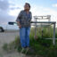 Loretta Johnson stands by a water well on the Navajo Nation in New Mexico. According to an EPA report, the well produces water tainted with arsenic. Credit: Jerry Redfern/Capital & Main