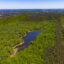 The Rock Mountain Lakes community (foreground) is located adjacent to the proposed data center site (background) in Jefferson County, Ala. Credit: Lee Hedgepeth/Inside Climate News