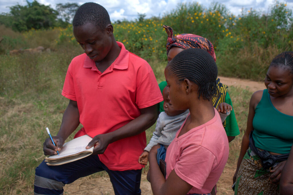 Community members in Kalusale, Zambia, sign up to become plaintiffs in a potential lawsuit against Sino-Metals Leach Zambia. Credit: Katie Surma/Inside Climate News