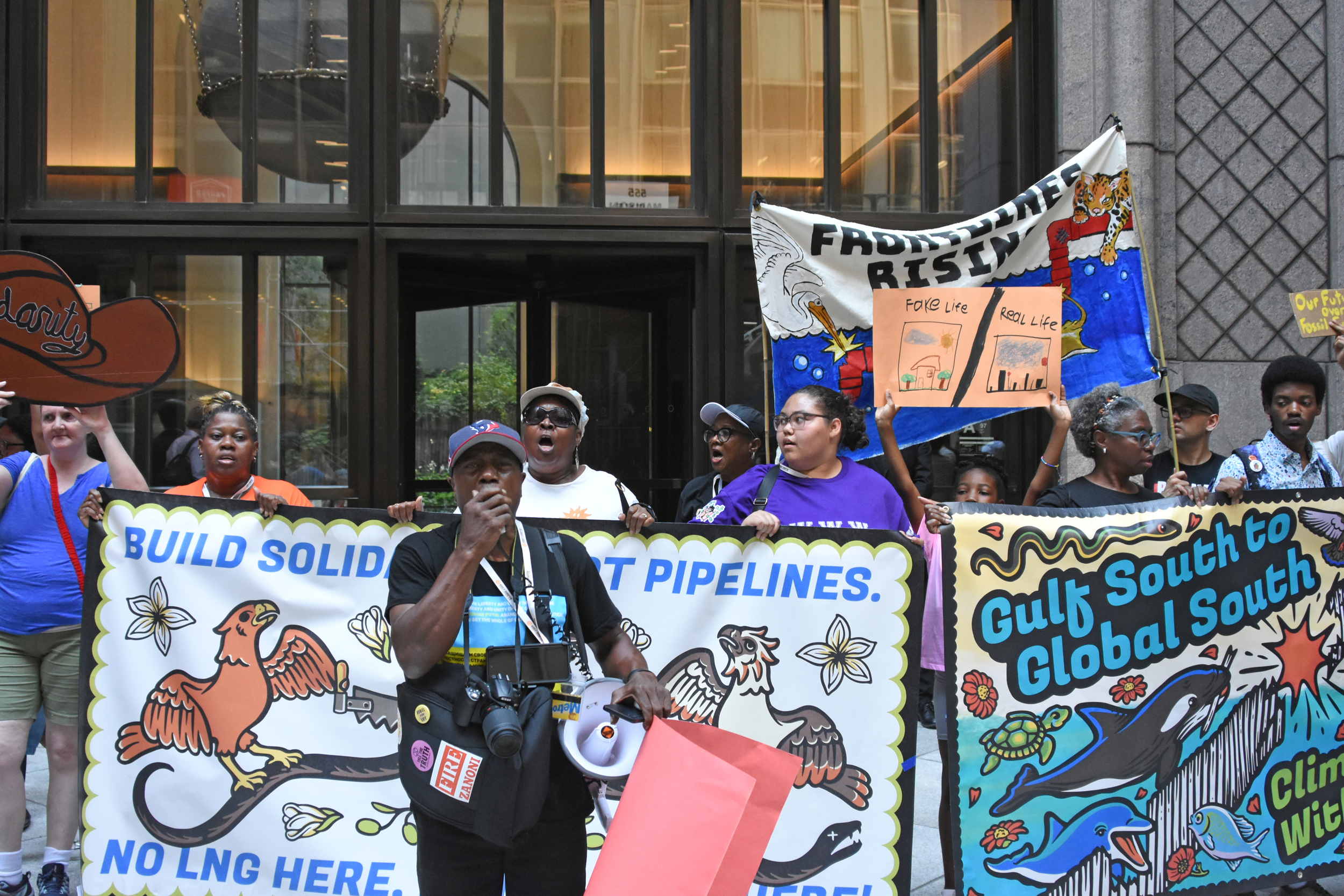 Manning Rollerson speaks in front of a crowd of demonstrators outside Chubb Insurance’s Midtown Manhattan headquarters in New York City. Credit: Ryan Krugman/Inside Climate News