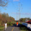 Transmission lines stand above a multi-use path adjacent to homes in Loudoun County, Va. Credit: Charles Paullin/Inside Climate News
