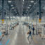 Employees walk the floor and supervise machines at the T1 Energy plant near Dallas. Credit: T1 Energy
