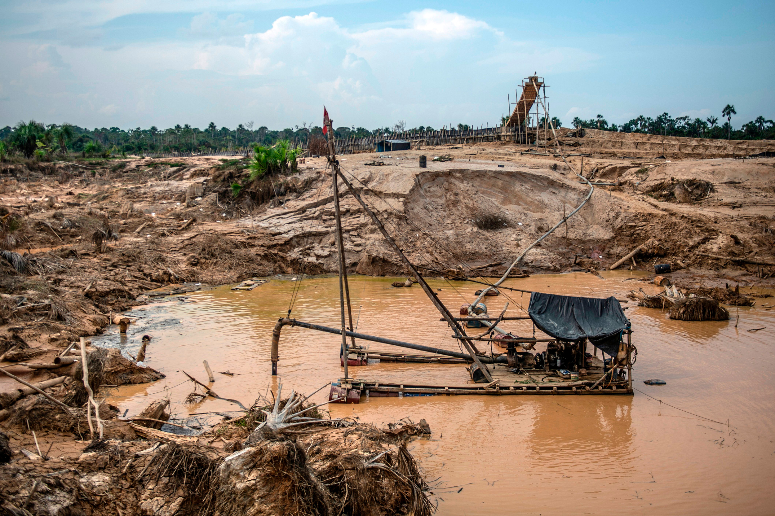 Illegal dredgers are used with mercury to extract gold dust near Puerto Maldonado in the Amazon rainforest of southeastern Peru. Credit: Ernesto Benavides/AFP via Getty Images