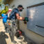 A foreman for the solar company Sunrun installs a 215-pound lithium-ion battery at a home in Granada Hills, Calif., on Jan. 4, 2020. Credit: Mel Melcon/Los Angeles Times via Getty Images