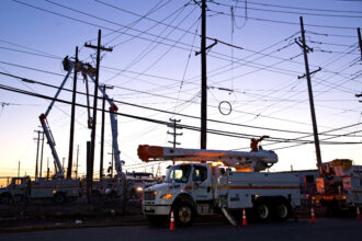 A crew with the Public Service Electric and Gas Company work on power lines in Ridgefield, N.J. Credit: EMAZ/VIEWpress