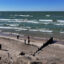 People walk a beach along Lake Michigan in Whiting, Ind. Credit: Scott Olson/Getty Images