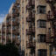 Air conditioning units hang out the windows of a housing project during a summer heat wave in the Bronx borough of New York on July 11, 2024. Credit: Angela Weiss/AFP via Getty Images