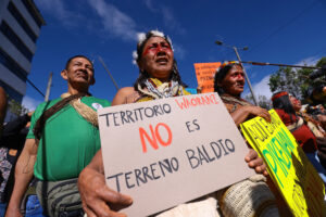 Waorani people protest against the oil tenders opened by the Ecuadorian Government on May 13 in Quito, Ecuador. Credit: Franklin Jacome/Agencia Press South via Getty Images