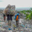Waste pickers carry plastic materials to recycle at the Gioto dumping site in Nakuru, Kenya. Credit: James Wakibia/SOPA Images/LightRocket via Getty Images