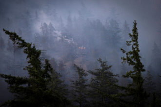 Smoke fills the landscape as a wildfire continues to grow on June 10 in Squamish, Canada. Credit: Nav Rahi/AFP via Getty Images