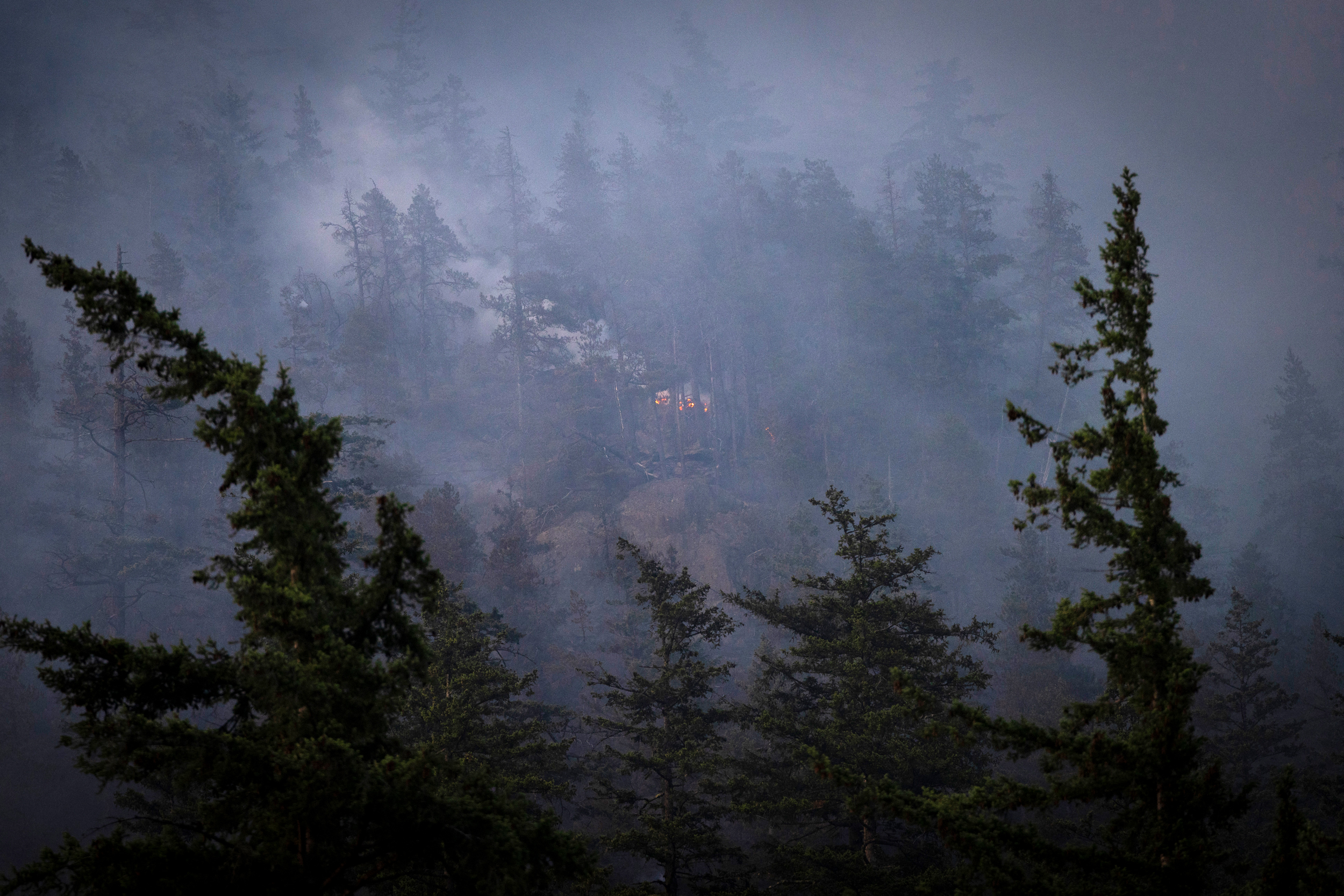 Smoke fills the landscape as a wildfire continues to grow on June 10 in Squamish, Canada. Credit: Nav Rahi/AFP via Getty Images