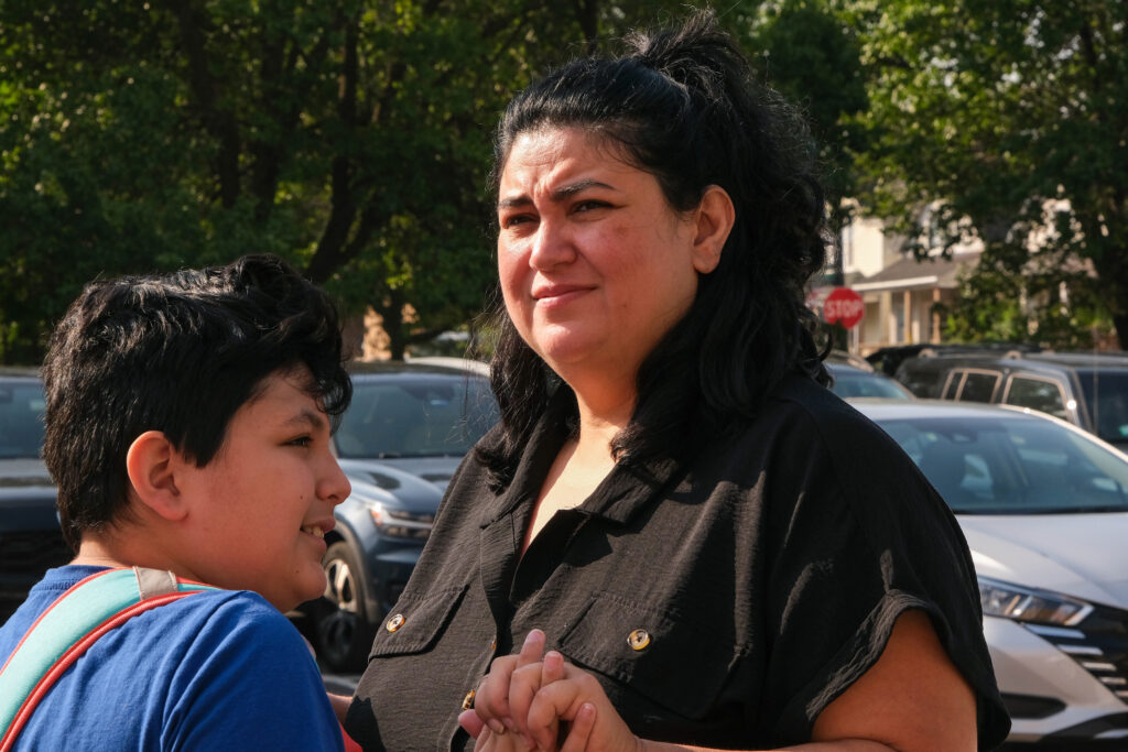 Most days, Gina Ramirez hands her 11-year-old son a plastic water bottle in the car because she doesn’t trust the water coming out of her tap at home. Credit: Keerti Gopal/Inside Climate News