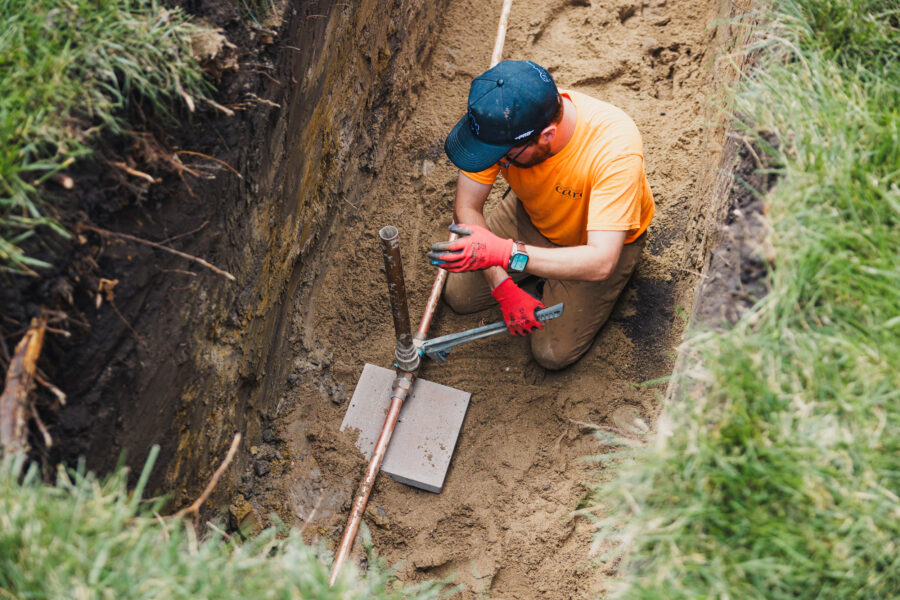 A worker replaces a main water lead pipe at a home in Chicago’s West Ridge neighborhood on July 25. Credit: Anthony Vazquez/Sun-Times