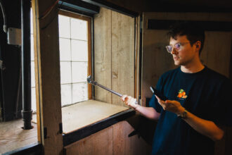 Colton Wyatt speaks about the different types of piping at his home in the Lincoln Square neighborhood of Chicago on July 18. Credit: Anthony Vazquez/Sun-Times