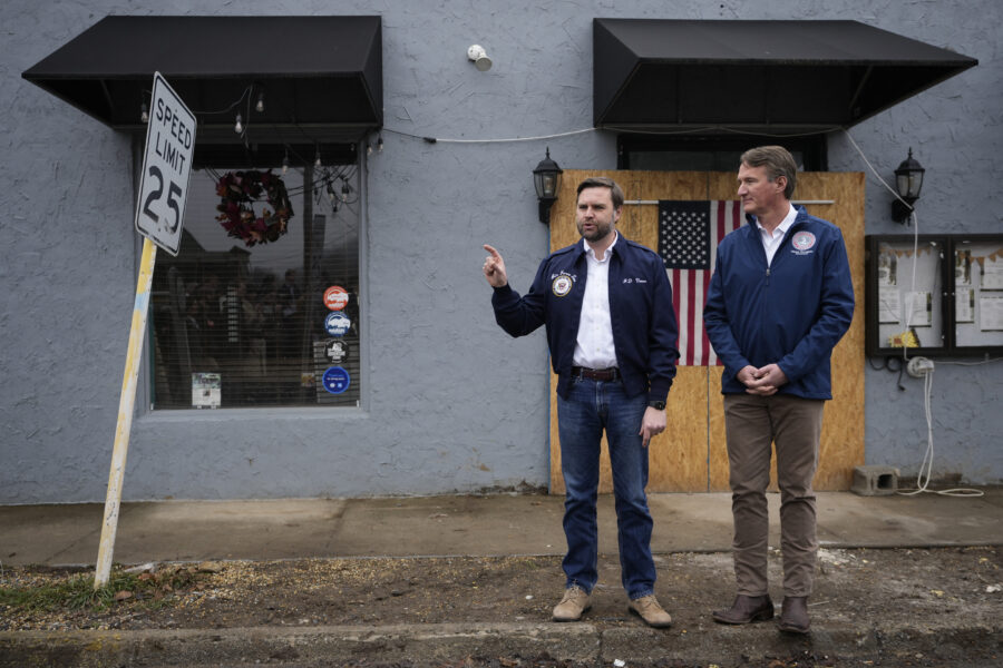 Vice President JD Vance (left) and Virginia Gov. Glenn Youngkin speak to the press outside on recovery efforts from Hurricane Helene in Damascus, Va., in January 2025. Nonprofits in parts of Southwest Virginia devastated by the storm want a restoration of climate resiliency funding terminated by the Trump administration. Credit: Ben Curtis/AFP via Getty Images